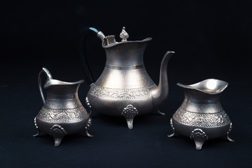 Lot 166 - A Continental white metal three-piece teaset,...