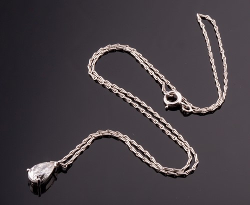 Lot 332 - A diamond solitaire pendant, set with a mixed...
