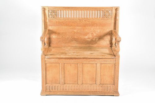 Lot 137 - A light oak monks bench, early 20th century,...