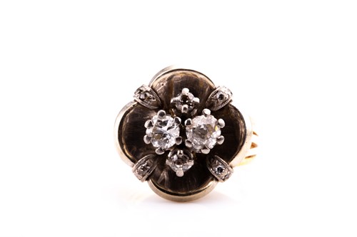 Lot 780 - A diamond cluster ring, the white metal mount...