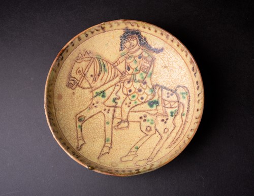 Lot 285 - A Persian Kashan pottery bowl, the yellow...