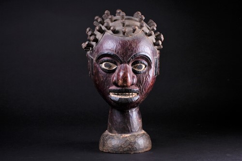 Lot 49 - An Ejagham (Ekoi) leather bound carved wood...