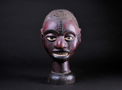 Lot 60 - An Ejagham (Ekoi) leather bound carved wood...
