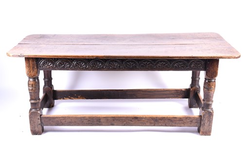 Lot 196 - An early 18th century oak table, the well...