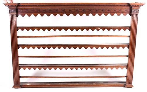 Lot 172 - A Geo III oak plate rack, the moulded pediment...