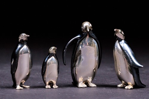Lot 269 - A group of four Saturno style silver and...