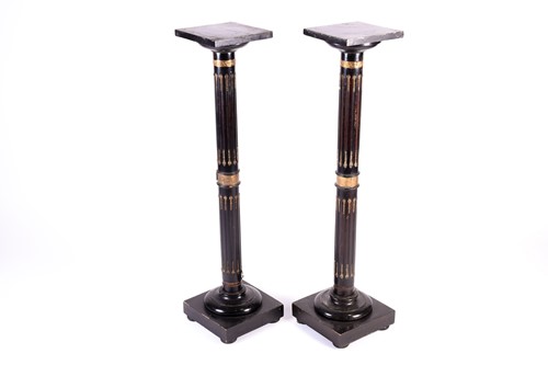 Lot 183 - A pair of aesthetic ebonised torcheres, late...