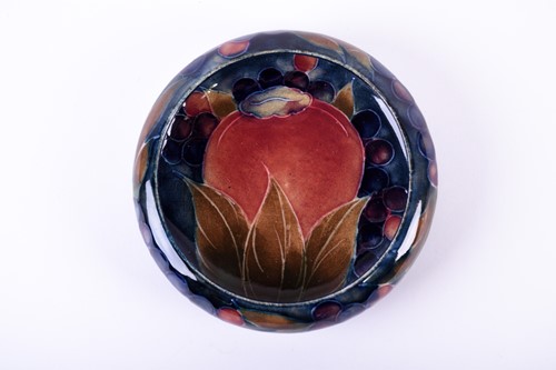 Lot 406 - A Walter Moorcroft pin dish in the Pomegranate...