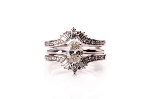 Lot 781 - A 14ct white gold and mixed oval-cut solitaire...