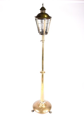 Lot 377 - An early 20th century polished brass standard...