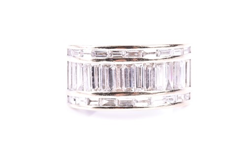 Lot 335 - A three row diamond ring, the central band of...