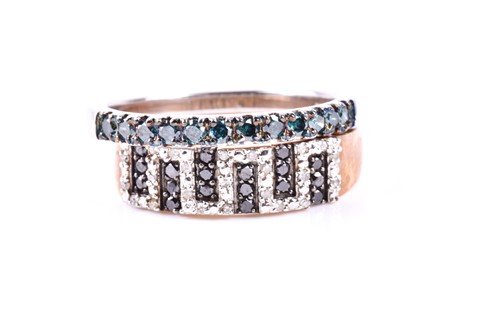 Lot 369 - A black and clear diamond ring, set in Greek...