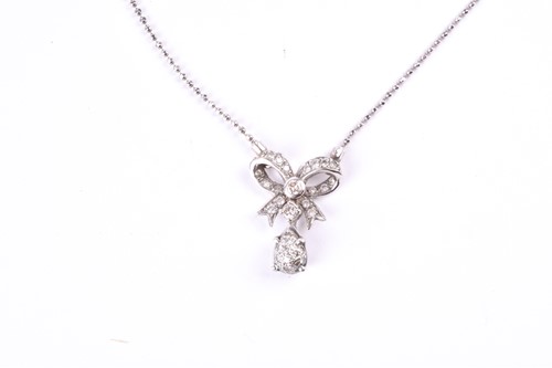 Lot 389 - A diamond set bow pendant, the bow set with a...