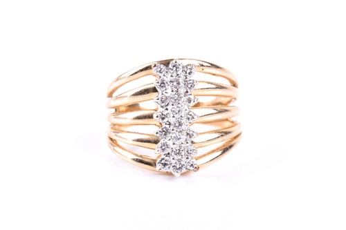 Lot 581 - A yellow metal and diamond dress ring, the...