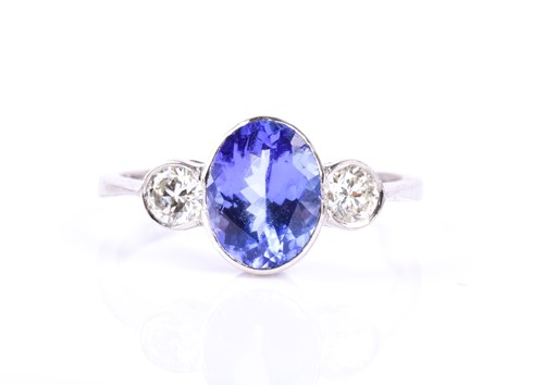 Lot 367 - A platinum, diamond, and tanzanite ring, bezel-...