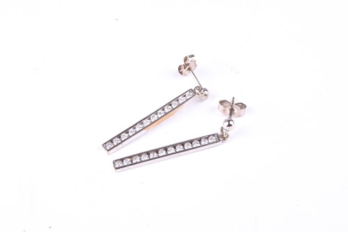 Lot 518 - A pair of 9 ct white gold pendant earrings and...