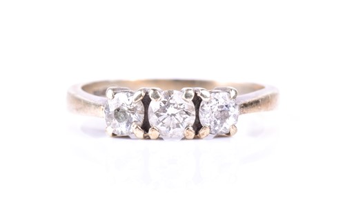 Lot 341 - A three stone diamond half hoop ring, the...