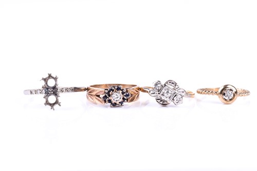 Lot 565 - A 9ct yellow metal and diamond ring, with rope-...
