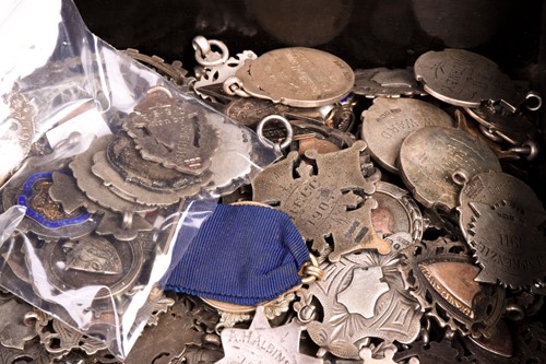 Lot 97 - Approximately 127 silver fob medallions,...