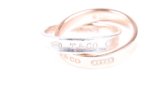 Lot 405 - A Tiffany interlocking circles ring, the rose...