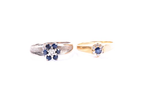 Lot 584 - A sapphire and diamond cluster ring, the...