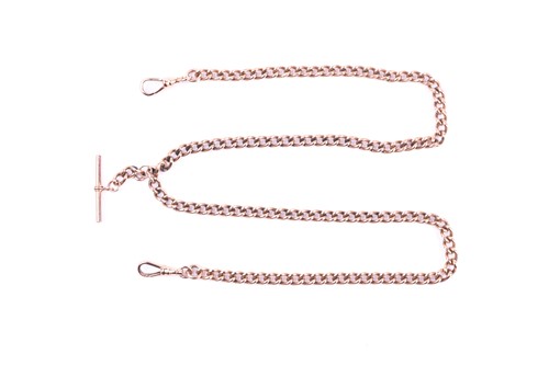 Lot 588 - A 9ct rose gold watch chain, the graduated...
