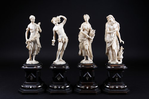 Lot 397 - A group of four 19th century European ivory...