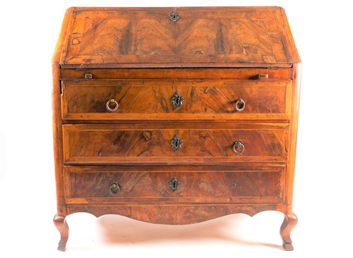 Lot 193 - A Continental walnut veneered bureau, late...