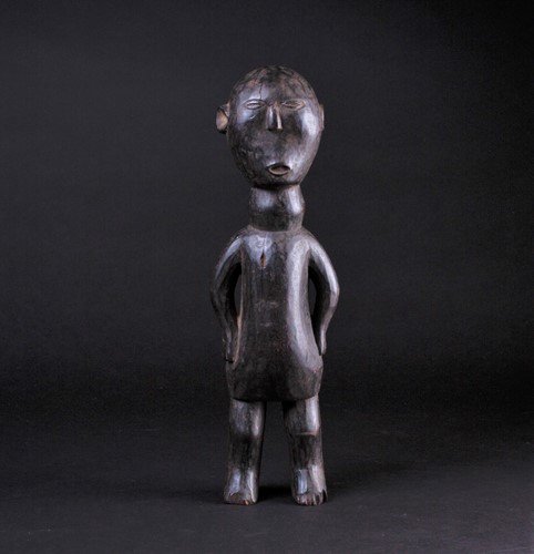 Lot 16 - An East African carved wood standing figure of...