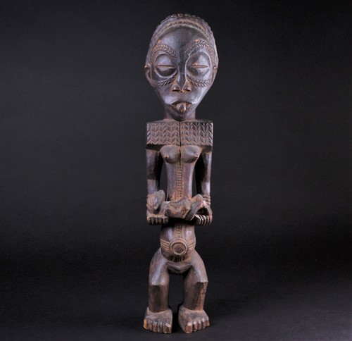 Lot 51 - A carved wood Bembe standing maternity figure,...