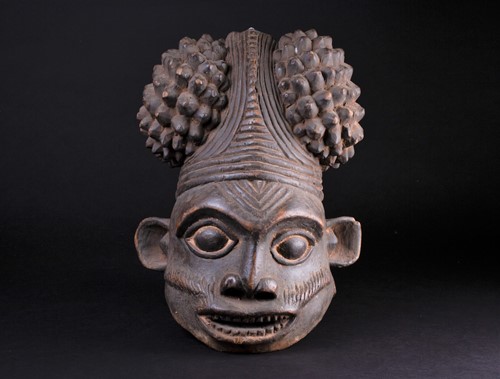 Lot 73 - A Bamum Bangwa carved wood mask, Cameroon, the...