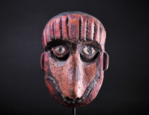Lot 14 - A carved and painted wood zoomorphic mask,...