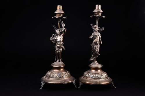 Lot 545 - A pair of Continental white metal candlesticks,...