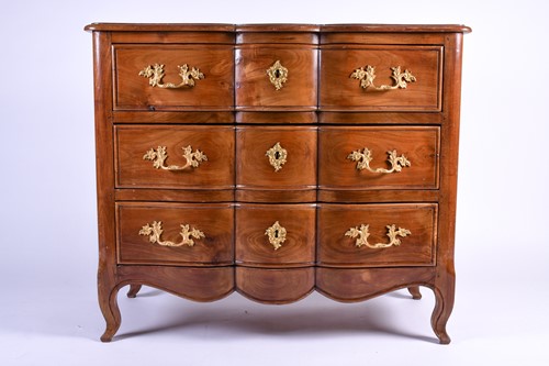 Lot 106 - A French walnut chest of three long drawers,...