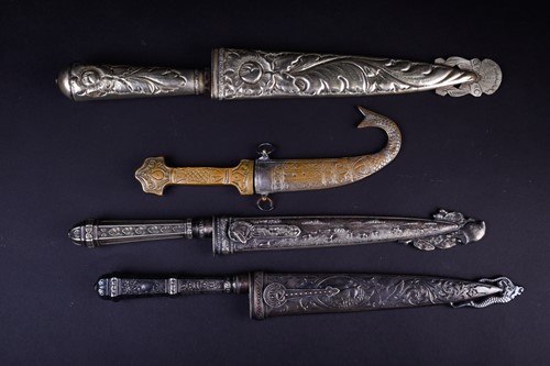 Lot 419 - Three Gaucho knives, two with white metal...