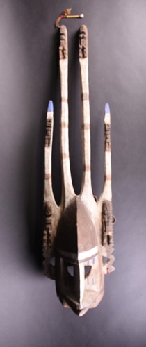 Lot 25 - A Dogon mask, Mali, with two tall central...
