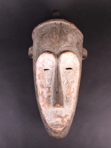 Lot 70 - A fang mask, Gabon, the long face with kaolin,...