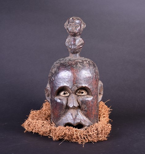 Lot 4 - A Bamum Janus mask, Cameroon, with kaolin...