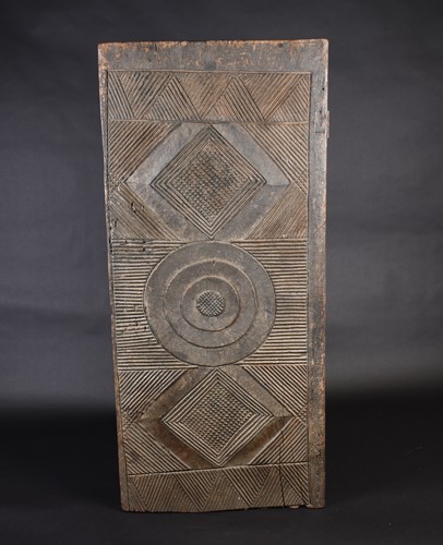 Lot 53 - An Igbo carved wood door, Nigeria, the...