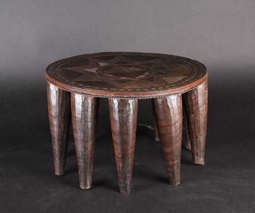 Lot 120 - A Nupe stool, Nigeria, the circular top with a...