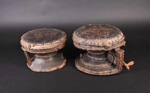Lot 121 - A near pair of West African hardwood drums, of...