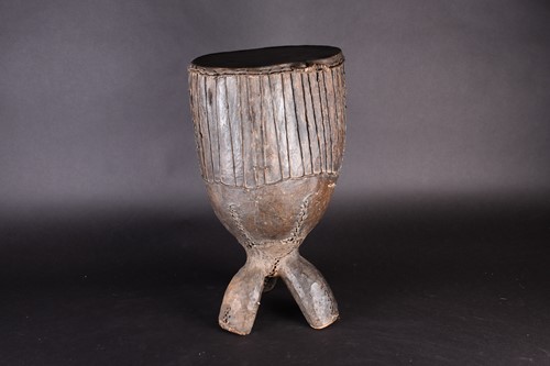 Lot 97 - A West African freestanding drum, the wood...
