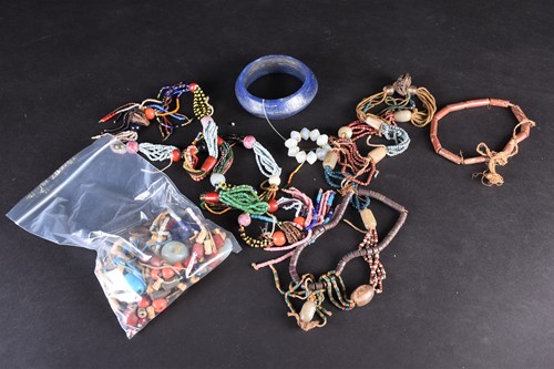 Lot 129 - A group of assorted African glass and other...