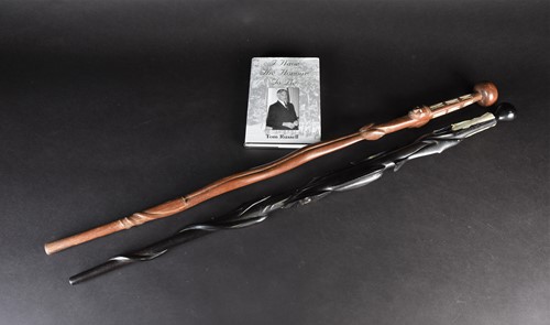 Lot 114 - Two Solomon Islands carved wood walking sticks,...
