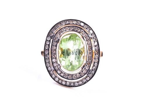 Lot 609 - A silver gilt, peridot, and diamond cocktail...