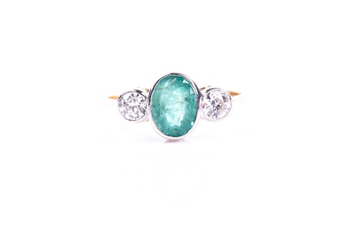 Lot 630 - An 18ct yellow gold, diamond, and emerald ring,...