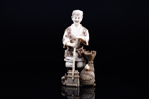 Lot 162 - A Japanese ivory okimono of a farmer, Meiji...
