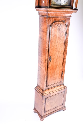 Lot 530 - A Georgian walnut long case clock, the arched...