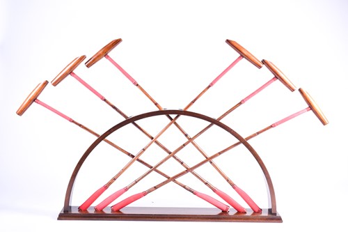 Lot 521 - A set of six polo mallets, with bamboo shafts,...