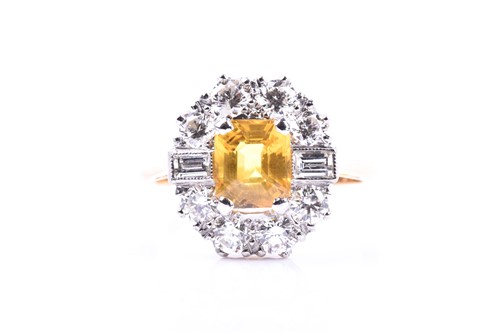 Lot 42 - A diamond and yellow sapphire cluster ring,...